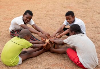african-children-with-football-ball-sitting