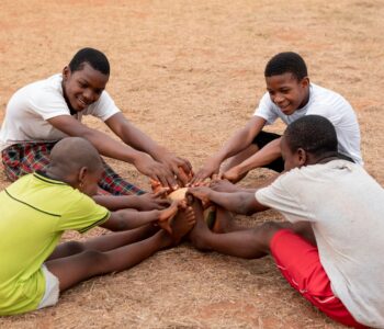 african-children-with-football-ball-sitting