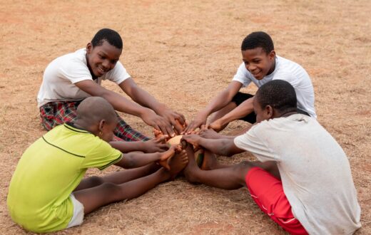 african-children-with-football-ball-sitting